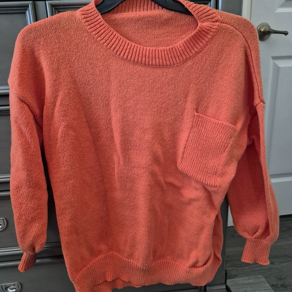 Light orange sweater